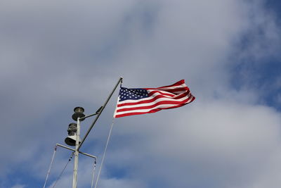 Low angle view of flag against sky