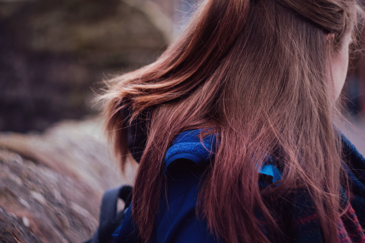 hair, one person, lifestyles, adult, real people, leisure activity, women, long hair, brown hair, hairstyle, rear view, focus on foreground, headshot, human hair, portrait, day, redhead, nature, blond hair, straight hair, warm clothing, dyed hair