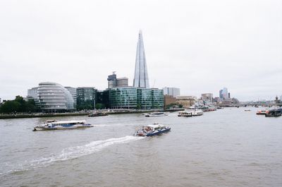 View of buildings in city against sky