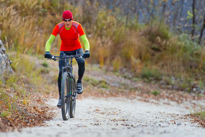 Man riding bicycle on road