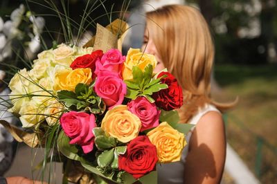 Bride by rose bouquet