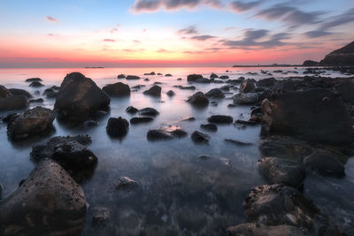 Scenic view of sea against sky during sunset