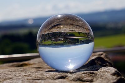 Close-up of crystal ball on glass