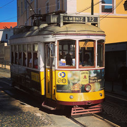 Train on railroad track in city