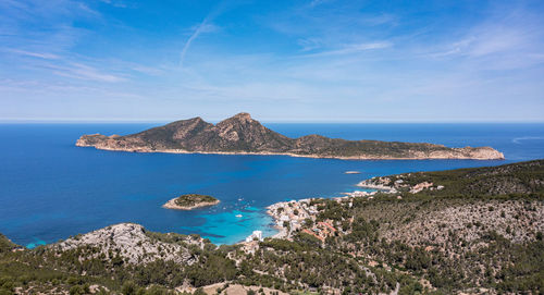 Scenic view of the sea with and island seen from the mainland at majorca, spain