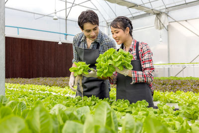 Woman standing in greenhouse