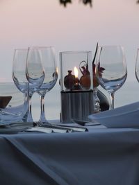 Close-up of wine glasses on table