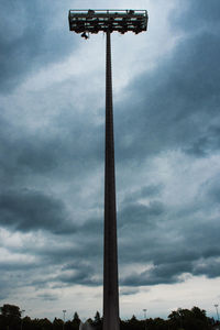 Low angle view of telephone pole against sky