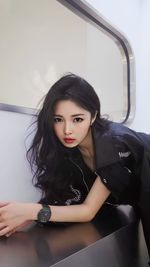 Portrait of young woman in car