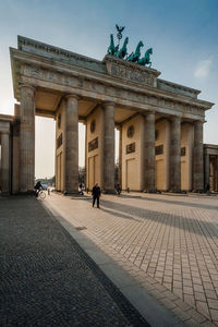 Brandenburg gate against sky in city