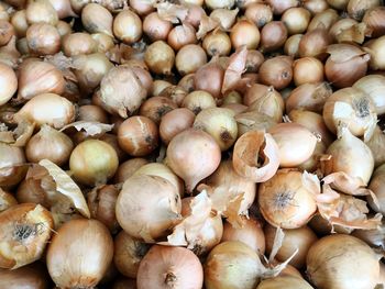 Full frame shot of onions for sale at market stall