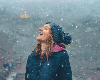 Portrait of young woman standing outdoors