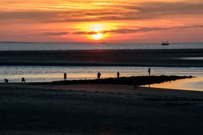 Scenic view of beach against sky during sunset