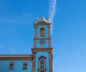 Low angle view of clock tower against blue sky