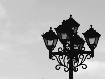Low angle view of lamp post against sky