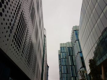 Low angle view of skyscrapers against clear sky