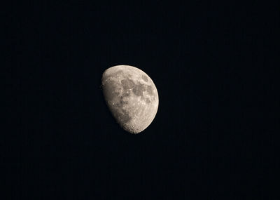 Low angle view of moon against sky at night