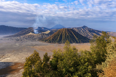 Panoramic view of volcanic landscape against cloudy sky