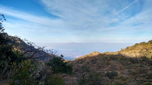 Scenic view of sea against cloudy sky