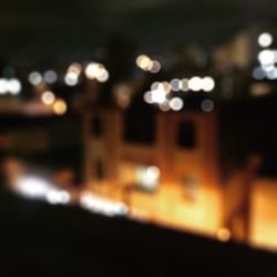 Defocused image of illuminated city at night