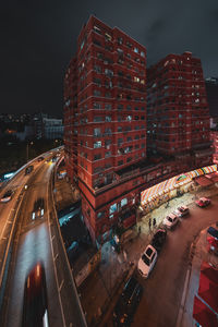 High angle view of illuminated city buildings at night