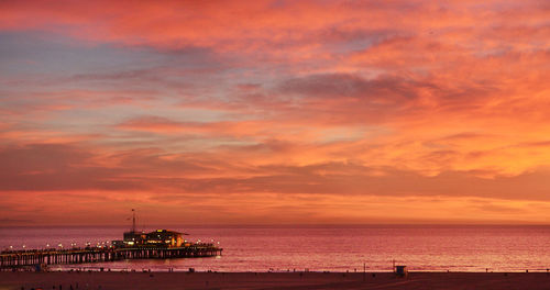 Scenic view of sea against orange sky