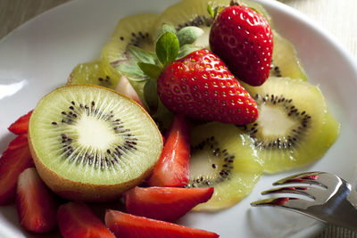 Close-up of fruits in plate on table