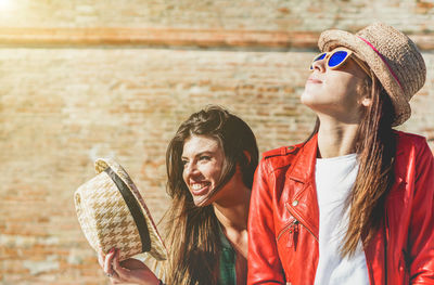 Portrait of young woman wearing sunglasses