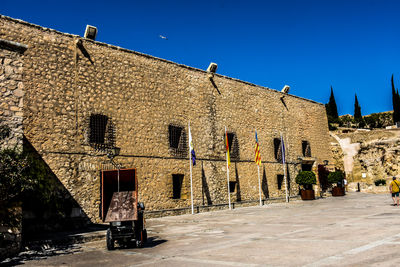 Buildings against clear blue sky