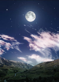 Scenic view of landscape against moon at night