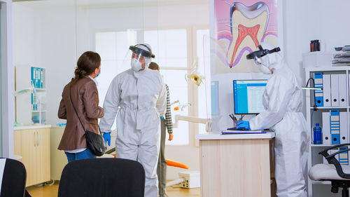 Portrait of female friends working in office