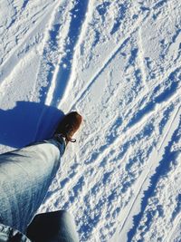 Low section of man on snow