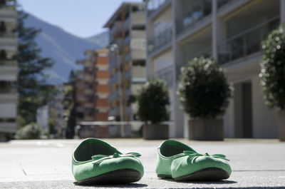 Close-up of shoes on built structure