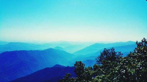 Scenic view of mountains against clear blue sky