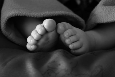 Close-up of child sleeping on bed