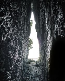 Scenic view of sea seen through cave