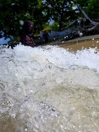 Reflection of people on wet land