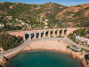 Aerial flight over viaduc d'anthéor and the massif de l'esterel on the coast of mediterranean sea 