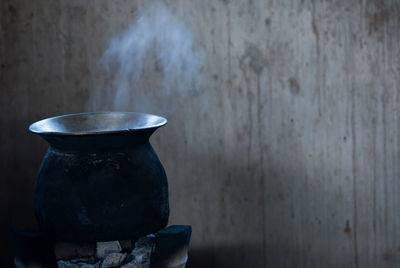 Close-up of food being cooked on stove against wall