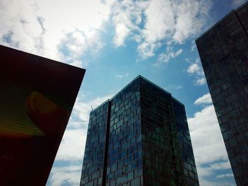 Low angle view of building against cloudy sky