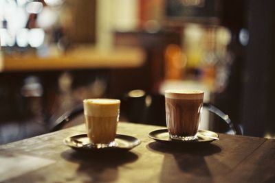 Close-up of coffee served on table at cafe