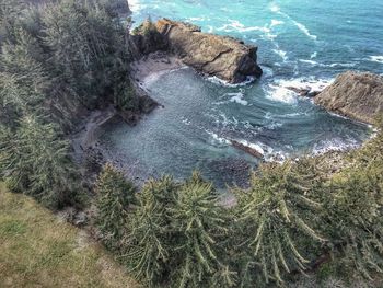 High angle view of rock formations by sea