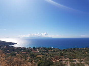 Scenic view of sea against clear blue sky