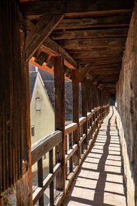 Wooden wall-walk  amidst buildings