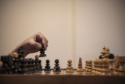 Low angle view of man playing on chess board