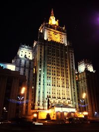 Low angle view of illuminated buildings at night