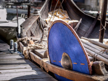 Abandoned boat moored at harbor