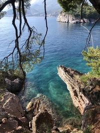 High angle view of rocks on sea shore