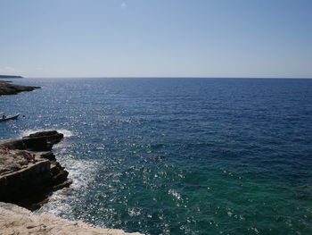 Scenic view of sea against clear sky