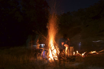 Bonfire on field at night